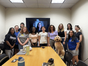 Students gathered around a conference table